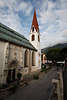 810112_ Seefeld in Tirol historische Kirche mit Sonnenuhr Foto aus Bergen sterreich
