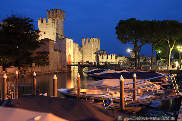 Sirmione fortress castle tower Garda lake night harbor cityscape