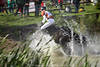 Cross country blurred & sharp action-picture wet dynamic movement in water-squirts