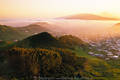 Fogs in sunset over la laguna city & volcano pico del teide of tenerife, highest mountain, canary islands travel