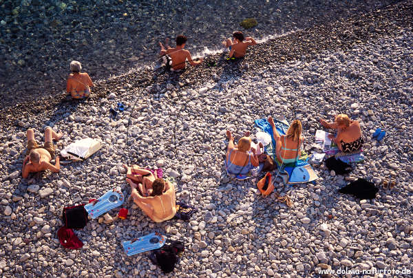 People on the beach Cote d'Azur vacation in the sun of south french riviera